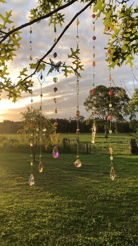 Hanging sun catchers outdoors glowing in evening sunlight